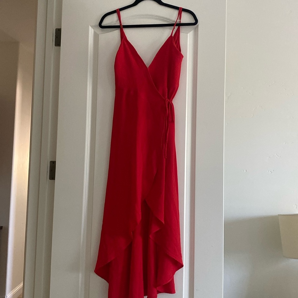 Show Me Your MuMu spaghetti strap, wrap around midi dress with high low front.